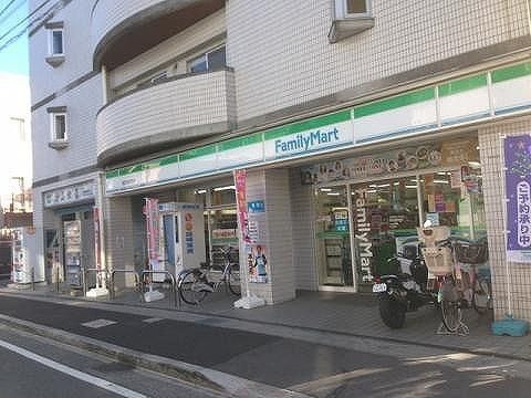 【周辺】　ファミリーマート稲田堤南口店　まで129ｍ